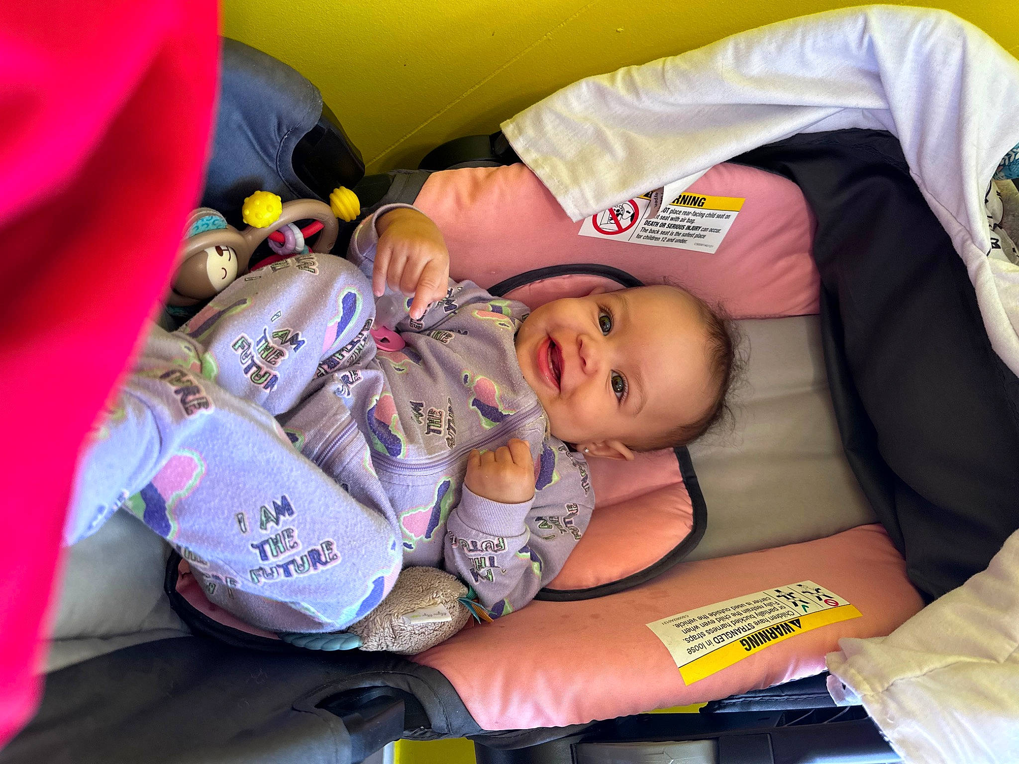 Aiyanna is registered to the contest to win money with this photo: baby, baby_carriage, baby_products, carmine, child, event, fun, happy, hat, lap, person, personal_protective_equipment, product, recreation, smile, t_shirt, toddler, yellow