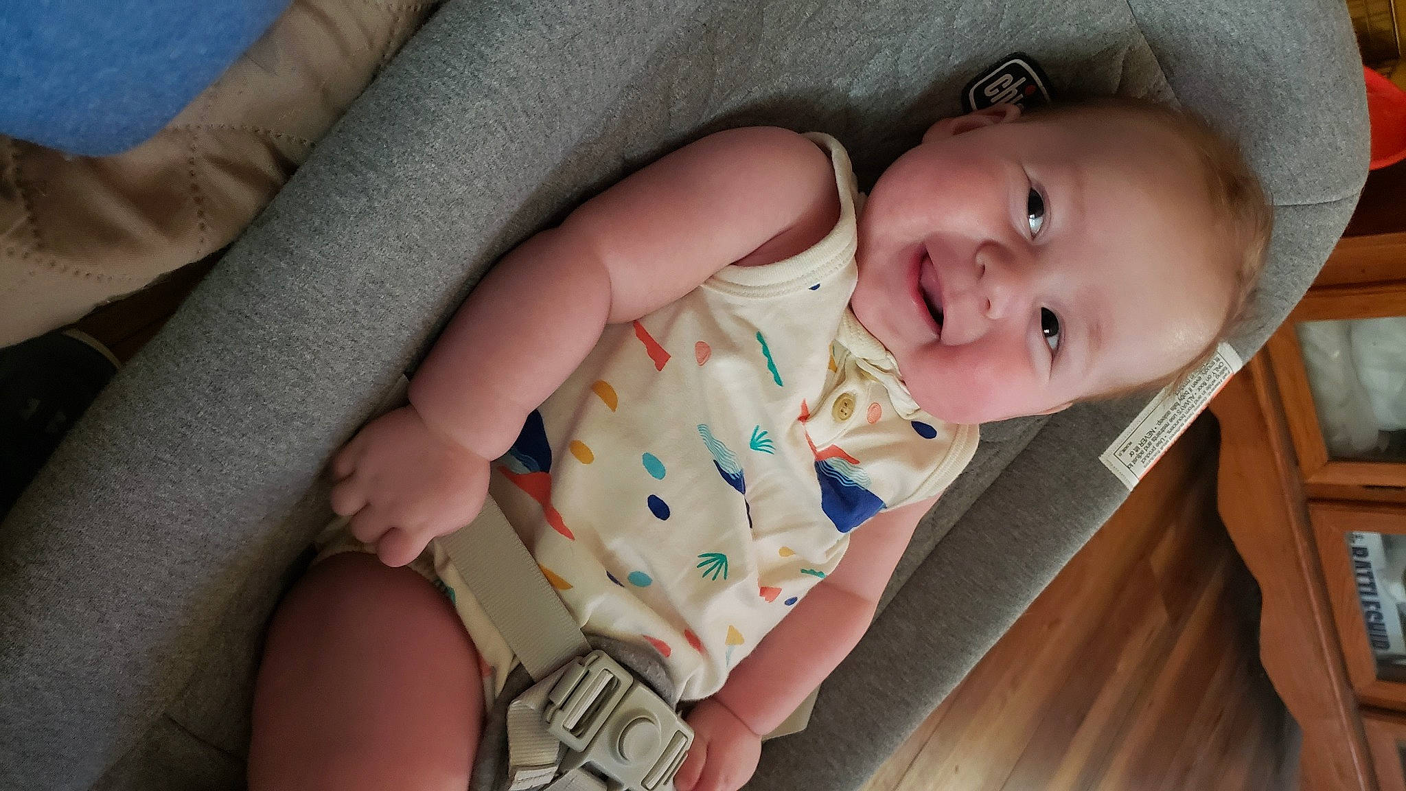 Ivan is registered to the contest to win money with this photo: baby, baby_products, baby_toddler_clothing, cheek, comfort, facial_expression, finger, foot, gesture, hand, human_body, human_leg, iris, mouth, nail, nose, person, skin, sleeve, thumb