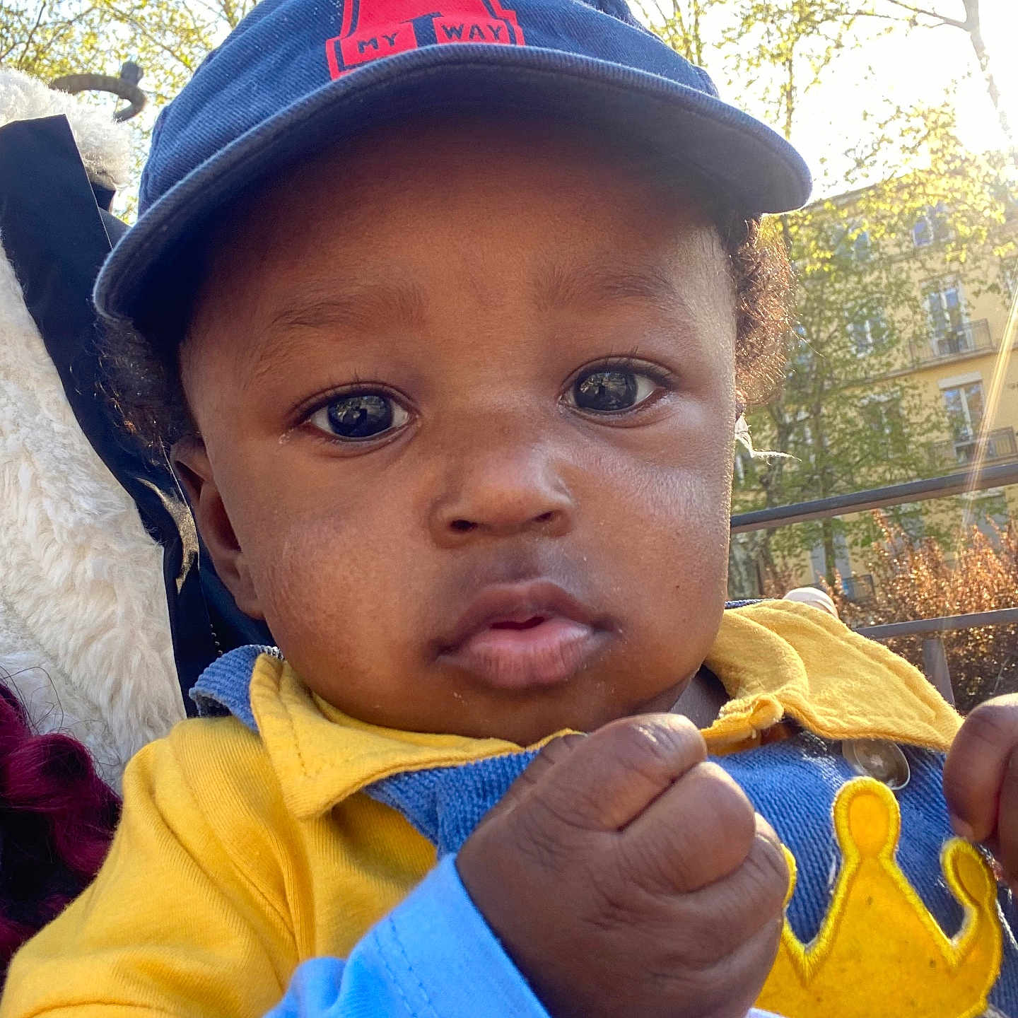 Himran participe au concours pour gagner de l'argent avec cette photo : baby, baseballcap, bodypart, cap, clothing, coat, cream, dessert, face, finger, food, glove, hand, hat, head, icecream, jacket, person, photography, portrait