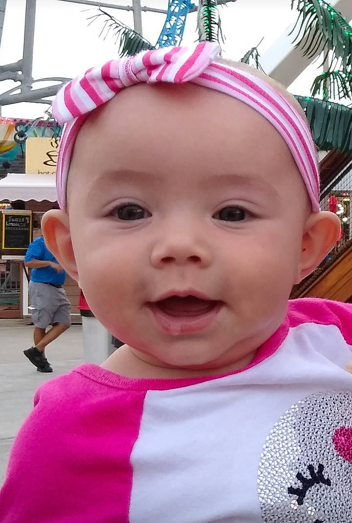 Aviana is registered to the contest to win money with this photo: baby, beauty, cheek, child, chin, ear, face, facial_expression, forehead, hair_accessory, happy, head, headgear, headwear, lip, mouth, nose, person, pink, skin