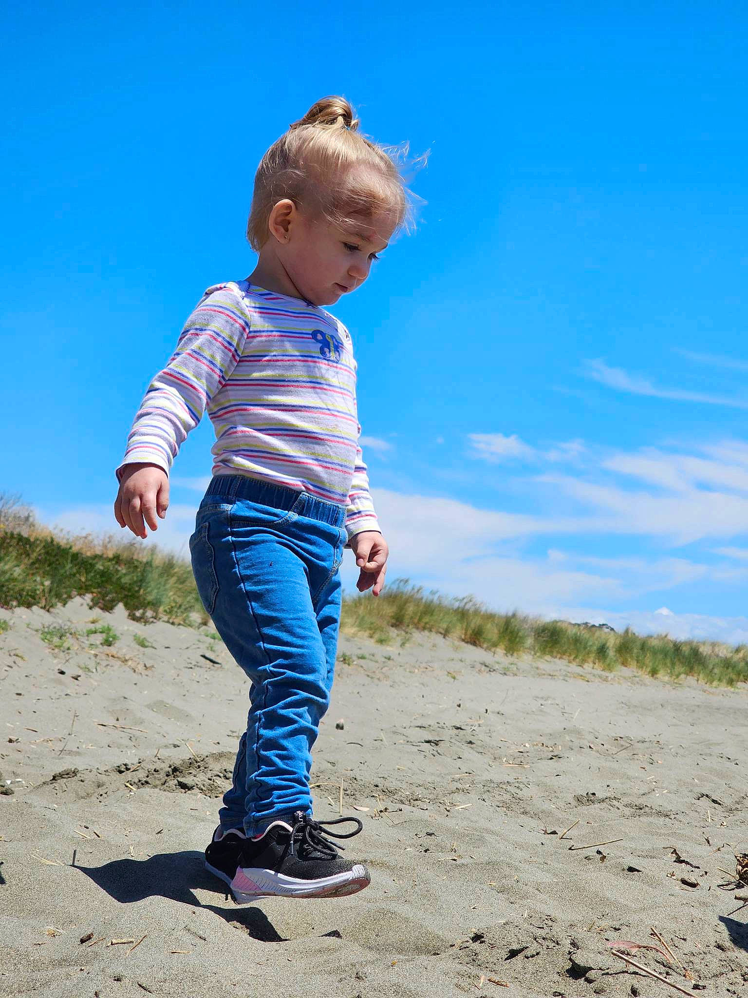 Sequoia is registered to the contest to win money with this photo: beach, child, cloud, denim, electric_blue, flash_photography, fun, gesture, grass, grassland, happy, horizon, landscape, leisure, people_in_nature, person, sand, sky, soil, t_shirt