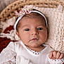 baby, infant, headband, flower, white_clothing, basket, blanket, knitted_blanket, portrait, cute, newborn, hand, face, eyes, indoors, soft_lighting, skin, baby_girl, cozy, resting