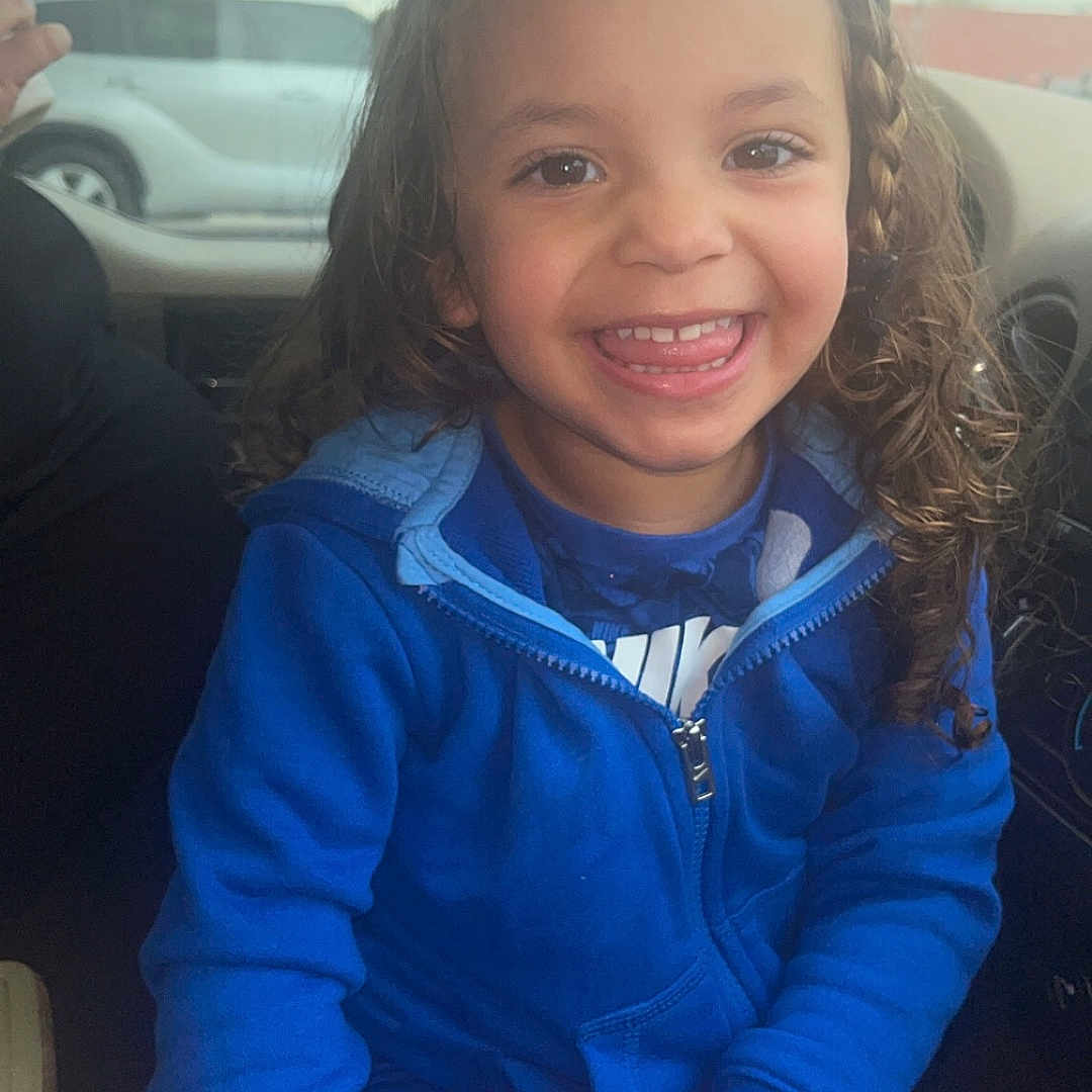 Claudia joined the competition — help win amazing prizes! bodypart, child, clothing, coat, face, female, finger, girl, hand, happy, head, jacket, machine, mouth, pants, person, photography, portrait, smile, wheel