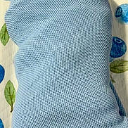 Brayden joined the competition — help win amazing prizes! newborn, baby, smiling, wrapped, blanket, blue, knit, infant, bed, patterned_sheet, face, happy, cute, child, portrait, lying_down, cozy, sleeping_area, skin, young