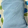 newborn, baby, smiling, wrapped, blanket, blue, knit, infant, bed, patterned_sheet, face, happy, cute, child, portrait, lying_down, cozy, sleeping_area, skin, young