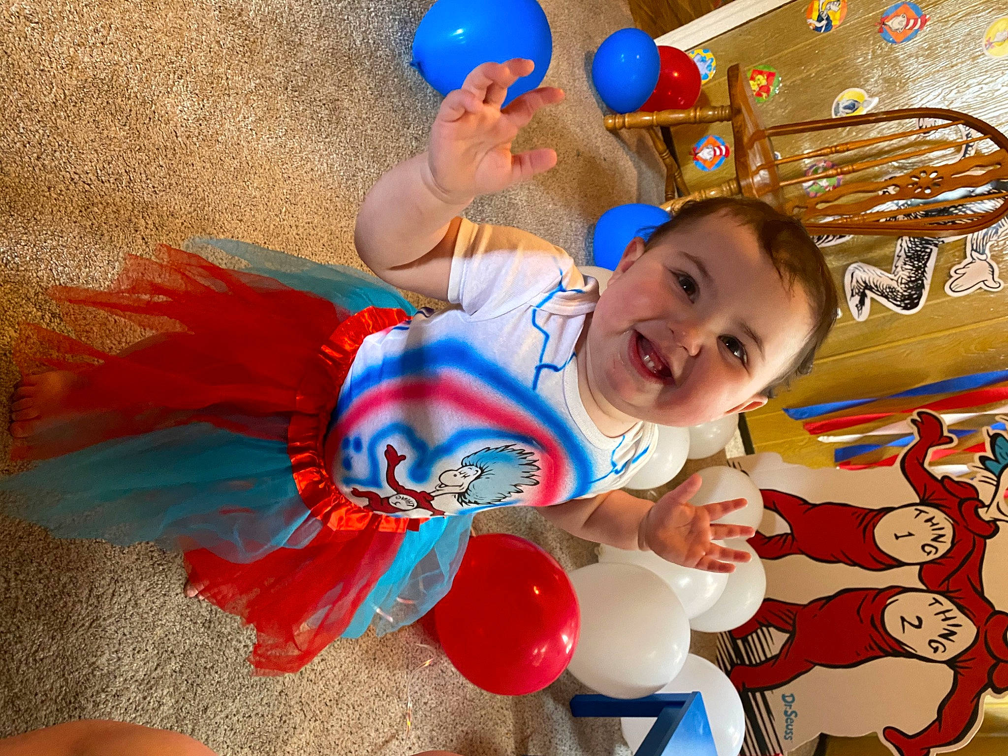 Leona'Marie is registered to the contest to win money with this photo: baby_toddler_clothing, balloon, blue, child, electric_blue, event, fictional_character, fun, happy, joy, laugh, leisure, party, party_supply, person, play, recreation, red, smile, t_shirt