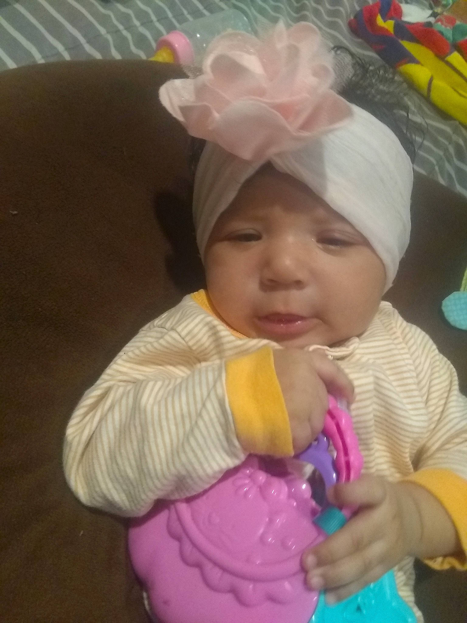 Roselyn is registered to the contest to win money with this photo: baby, baby_products, child, headgear, person, pink, play, product, toddler