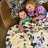 Giovanni joined the competition — help win amazing prizes! baby, child, couch, blanket, space_theme, rocket, planet, mickey_mouse, smile, happy, indoor, family, sibling, toddler, purple_clothing, green_clothing, carpet, cozy, holding_hands, portrait