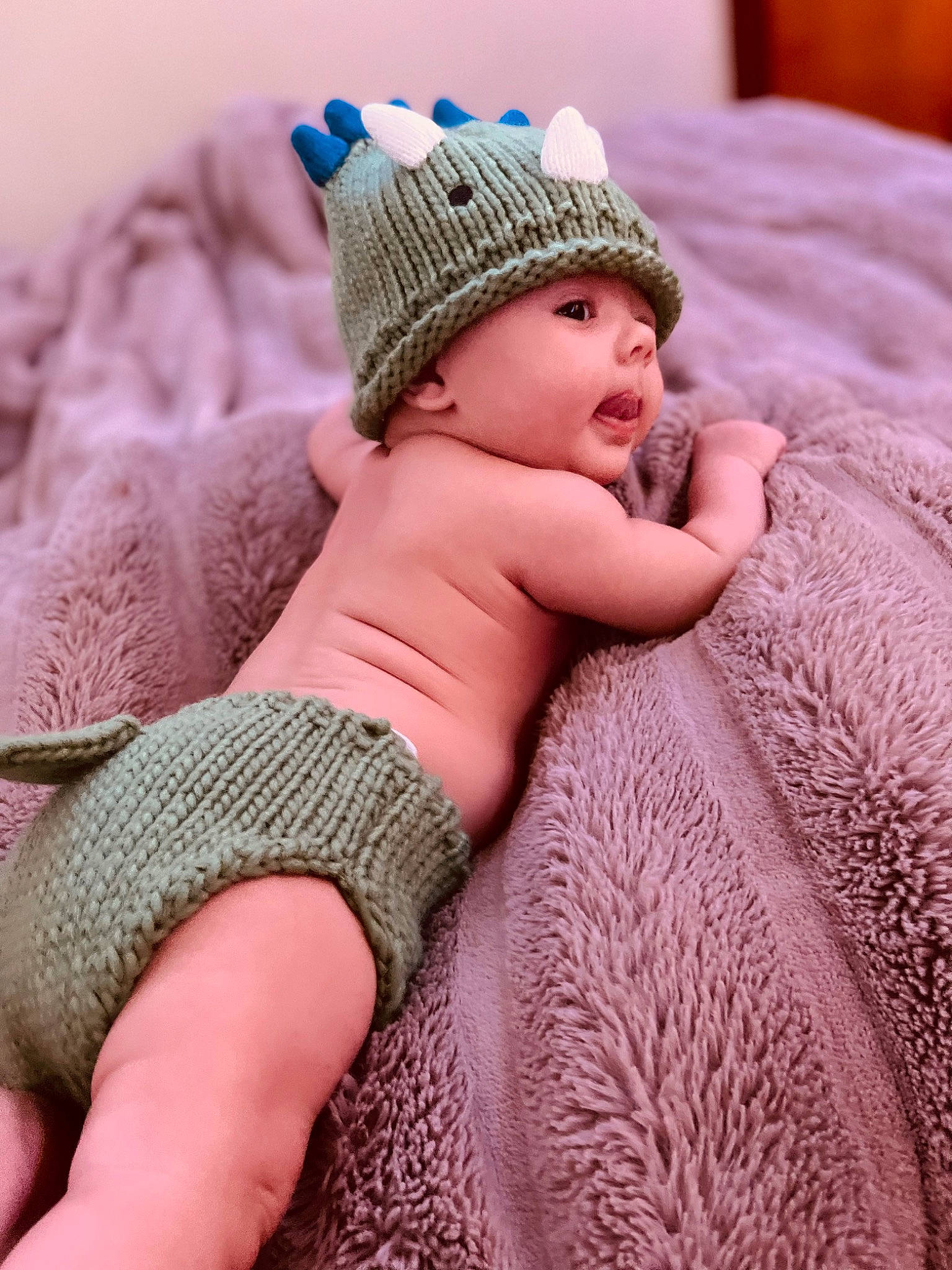 Jaxon joined the competition — help win amazing prizes! baby, baby_toddler_clothing, cap, child, comfort, face, grass, headgear, headwear, human_leg, knit_cap, magenta, pattern, person, photograph, pink, skin, sun_hat, textile, thigh
