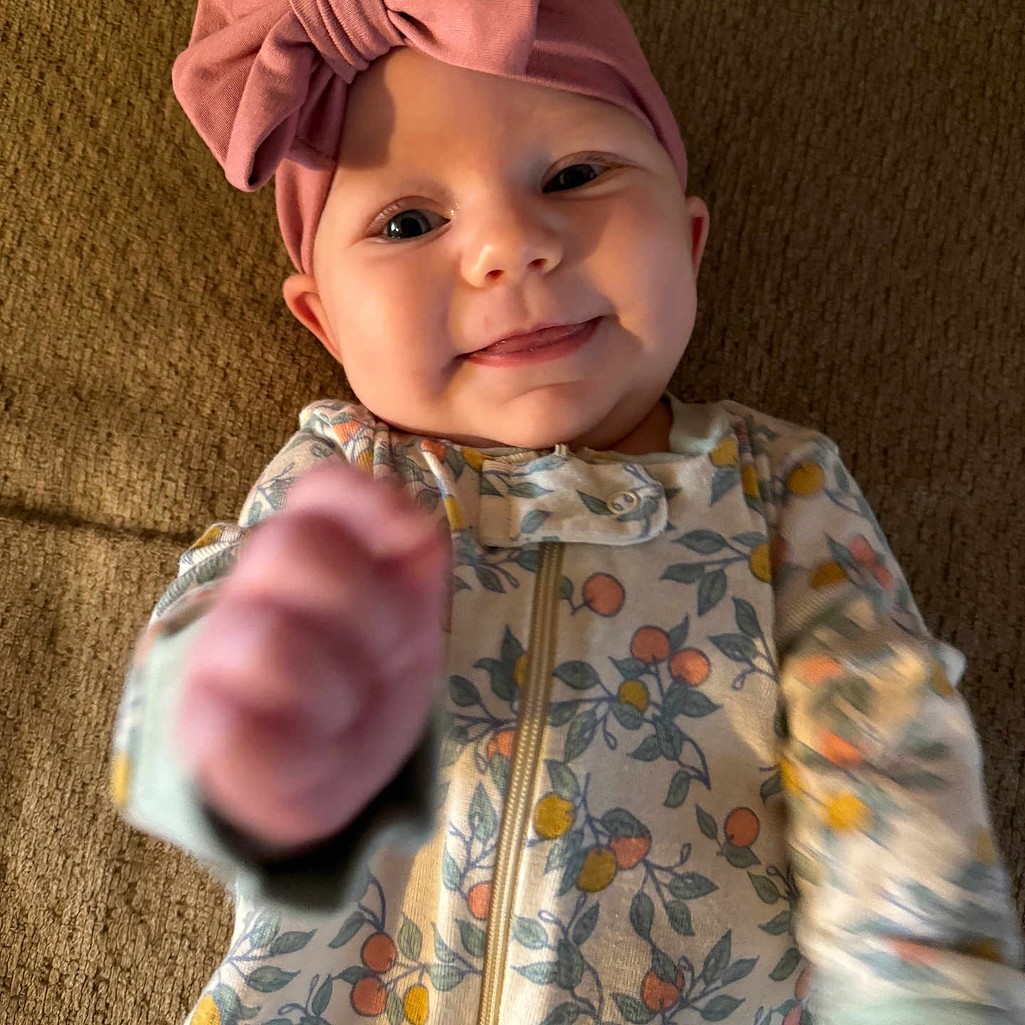 Myla is registered to the contest to win money with this photo: baby, bodypart, bonnet, cap, clothing, coat, face, finger, fleece, hand, hat, head, hoodie, jacket, knitwear, person, photography, portrait, sweater, sweatshirt