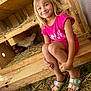 animal, casual, chicken_coop, chickens, child, daylight, farm, feet, girl, grass, happy, hay, nature, outdoor, person, pink_dress, sandals, smile, summer, wooden_structure