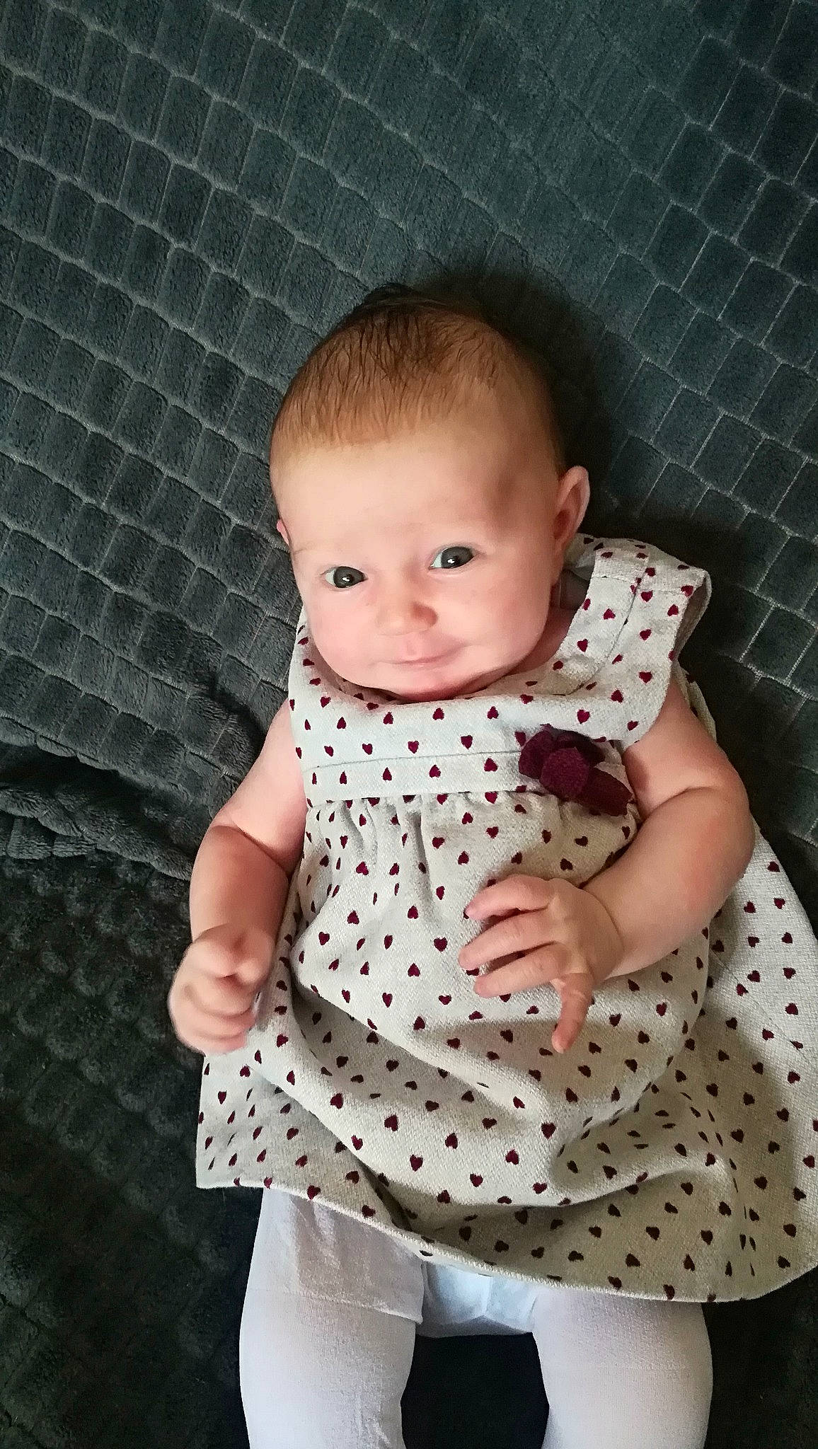 Lya a rejoint le concours — aidez-le/la à gagner de superbes lots ! baby, baby_products, baby_toddler_clothing, beauty, cheek, child, collar, day_dress, flash_photography, iris, linens, one_piece_garment, pattern, person, pink, sitting, skin, sleeve, smile, standing