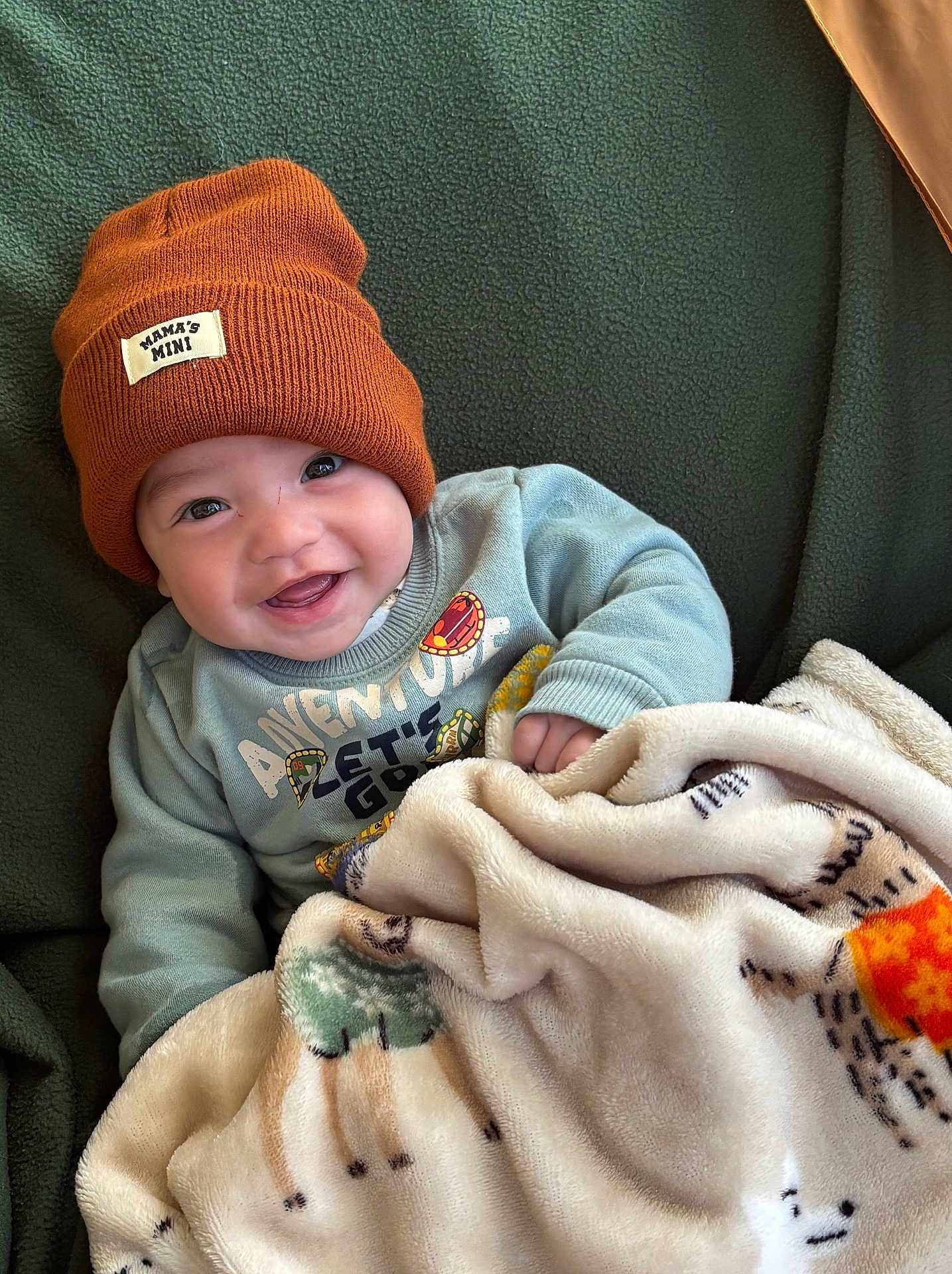 Elijah joined the competition — help win amazing prizes! baby, child, smiling, beanie, hat, blanket, cozy, sweater, cute, infant, happy, indoors, portrait, warm, soft, childwear, face, expression, comfort, seated