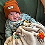 Elijah is registered to the contest to win money with this photo: baby, child, smiling, beanie, hat, blanket, animal_print, sweatshirt, cozy, cute, indoors, portrait, face, happy, warm, infant, baby_clothing, soft, comfort, toddler