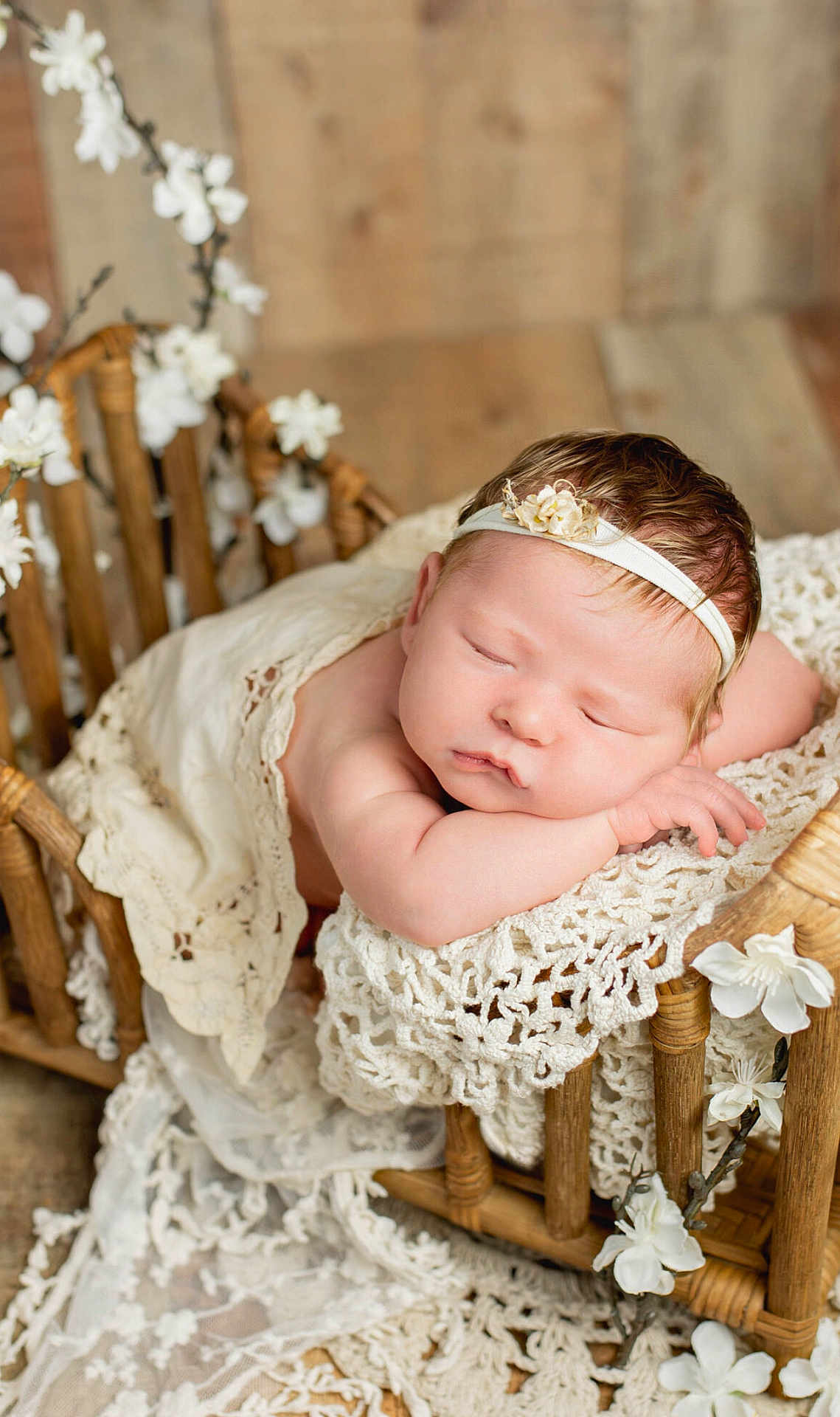 Alayna is registered to the contest to win money with this photo: baby, newborn, sleeping, lace, wooden_cradle, flower, headband, peaceful, infant, portrait, soft_lighting, blanket, resting, cute, cozy, delicate, closeup, caucasian, indoor, decorative