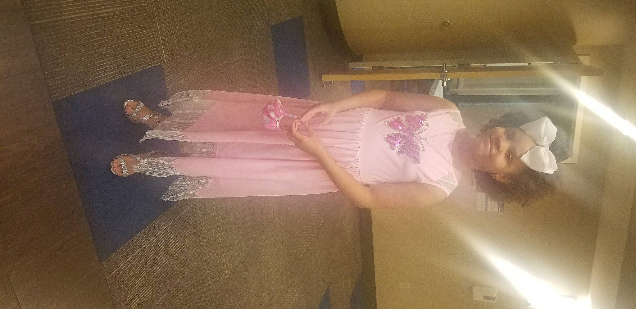 Alaynah is registered to the contest to win money with this photo: abdomen, ceiling, chest, dress, elbow, event, flesh, fun, hardwood, headwear, human_leg, joy, magenta, person, pink, plaster, room, textile, thigh, trunk