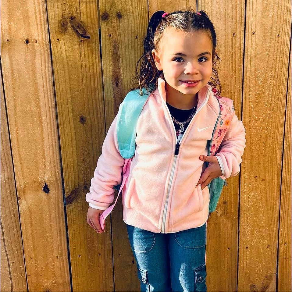 Harlie joined the competition — help win amazing prizes! brownhair, child, clothing, coat, curlyhair, dimples, face, female, girl, hair, hardwood, head, jacket, jeans, pants, person, sleeve, stainedwood, stethoscope, wood