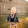 Willow joined the competition — help win amazing prizes! child, toddler, denim_jacket, scarf, cow_print, bell_bottom_pants, grass, barn, wooden_barn, star_decoration, outdoor, sunlight, blonde_hair, curious_expression, fashion, casual_clothing, portrait, daylight, standing, nature
