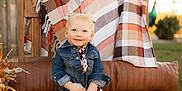 Willow joined the competition — help win amazing prizes! toddler, child, smiling, denim_jacket, cow_print_pants, boots, bench, plaid_blanket, outdoor, grass, wooden_furniture, fall_decor, sunlight, portrait, cute, pigtails, happy, fashion, nature, seasonal