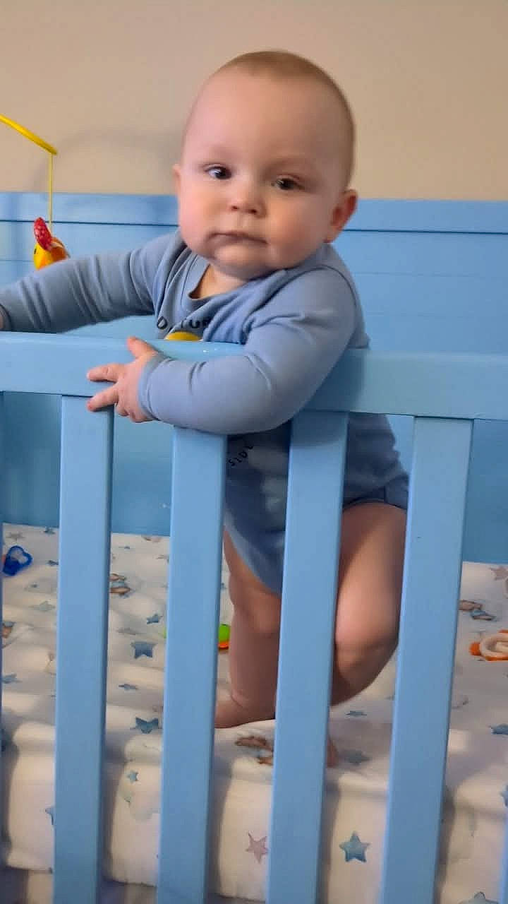 Michael joined the competition — help win amazing prizes! baby, bed, clothing, crib, cushion, face, furniture, head, homedecor, indoors, infantbed, person, photography, portrait, sleeve, standing