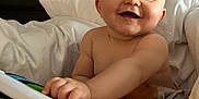 Christian-Levi joined the competition — help win amazing prizes! baby, smiling, toy, piano, blanket, bed, child, happy, playful, indoor, cute, infant, face, hand, person, cozy, soft, pillow, skin, expression