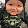 Christian-Levi is registered to the contest to win money with this photo: baby, child, smiling, face, beanie, clothing, green_shirt, shopping_cart, store, aisle, cute, portrait, indoor, person, headwear, infant, happy, closeup, blue_eyes, toddler