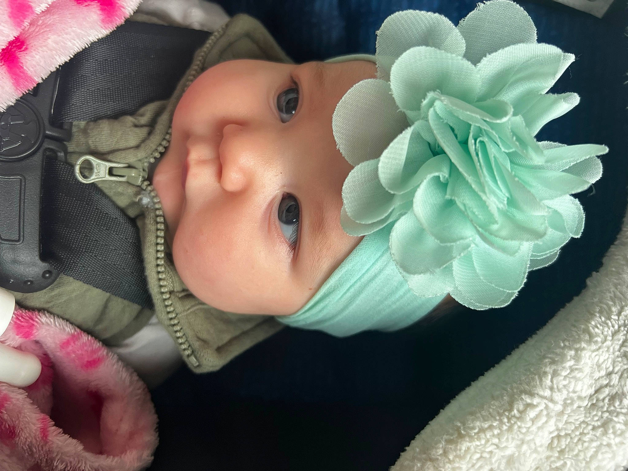 Penelope is registered to the contest to win money with this photo: baby, baby_toddler_clothing, cap, cheek, child, eyelash, fashion_accessory, hand, happy, headgear, headpiece, headwear, lip, nose, person, petal, pink, product, skin, sun_hat