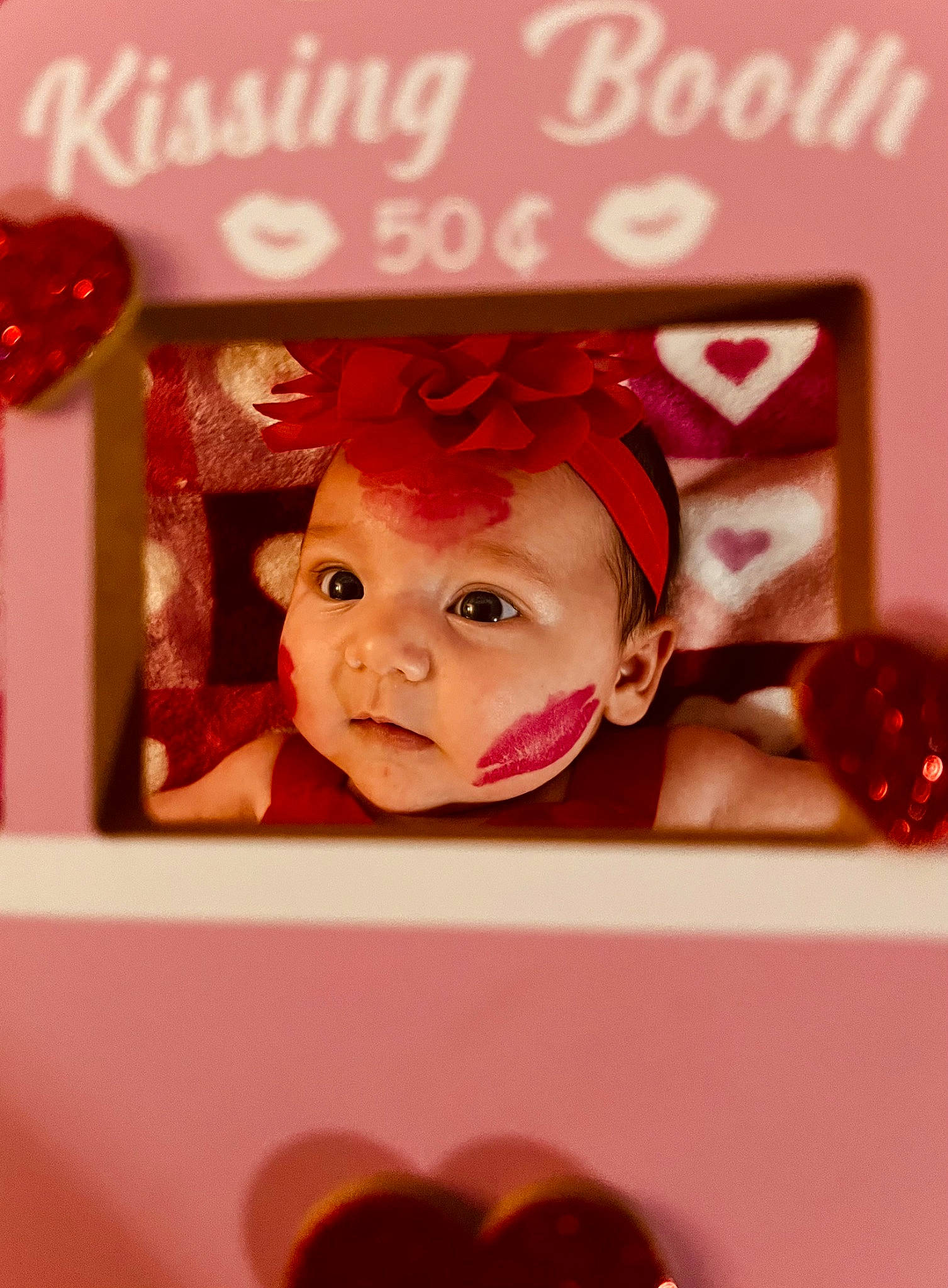 Penelope is registered to the contest to win money with this photo: baby, carmine, cheek, child, event, fashion_accessory, font, happy, headwear, icing, magenta, material_property, ornament, party_supply, person, pink, rectangle, red, room, sweetness