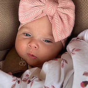 Inna participe au concours pour gagner de l'argent avec cette photo : baby, infant, face, headband, pink, blanket, floral_pattern, closeup, child, cute, soft_texture, knitwear, resting, indoors, portrait, young, wrapped, comfort, peaceful, expression