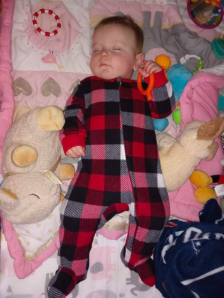 Malachi is registered to the contest to win money with this photo: baby, baby_products, baby_toddler_clothing, baby_toys, child, comfort, doll, linens, pattern, person, pink, plaid, room, sleeve, sock, stuffed_toy, tartan, teddy_bear, textile, toddler