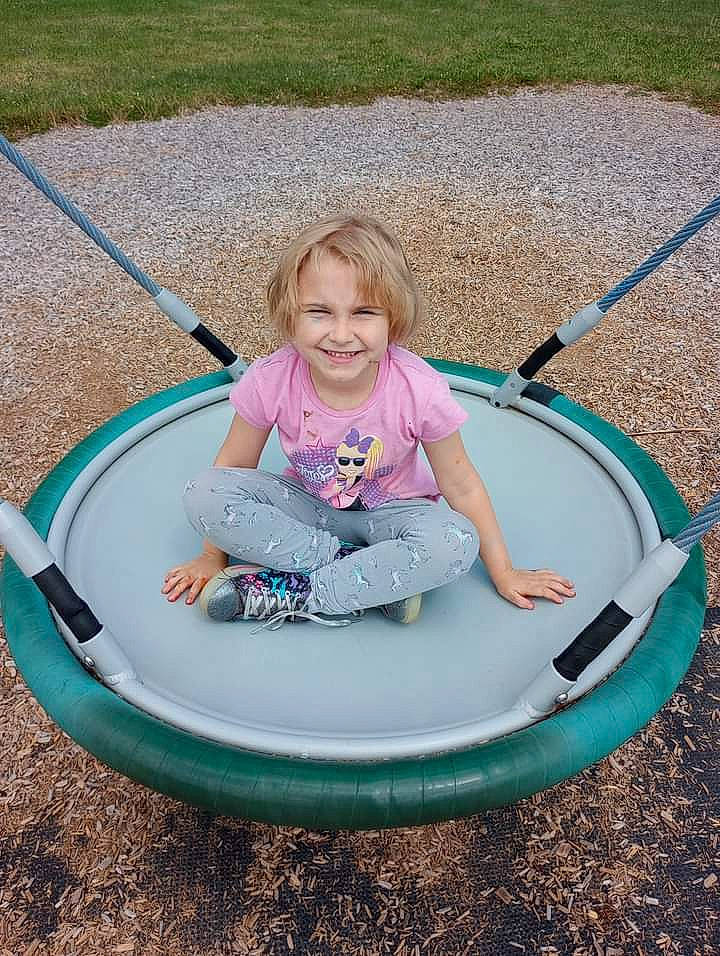 Jaylah joined the competition — help win amazing prizes! automotive_tire, baby_toddler_clothing, child, circle, fun, grass, hand, happy, joy, leisure, outdoor_play_equipment, people_in_nature, person, pink, playground, public_space, recreation, shoe, smile, sneakers