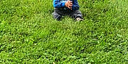 John Axziel joined the competition — help win amazing prizes! alone, casual, casual_clothing, child, clapping_hands, curly_hair, daylight, field, grass, grass_field, greenery, kid, nature, outdoor, park, person, portrait, relaxing, sitting, young