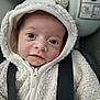 baby, infant, hoodie, white, fluffy, pom_pom, face, blue_eyes, close_up, cute, young_child, straps, clothing, portrait, child, warm_clothing, indoors, soft_texture, looking_at_camera, adorable