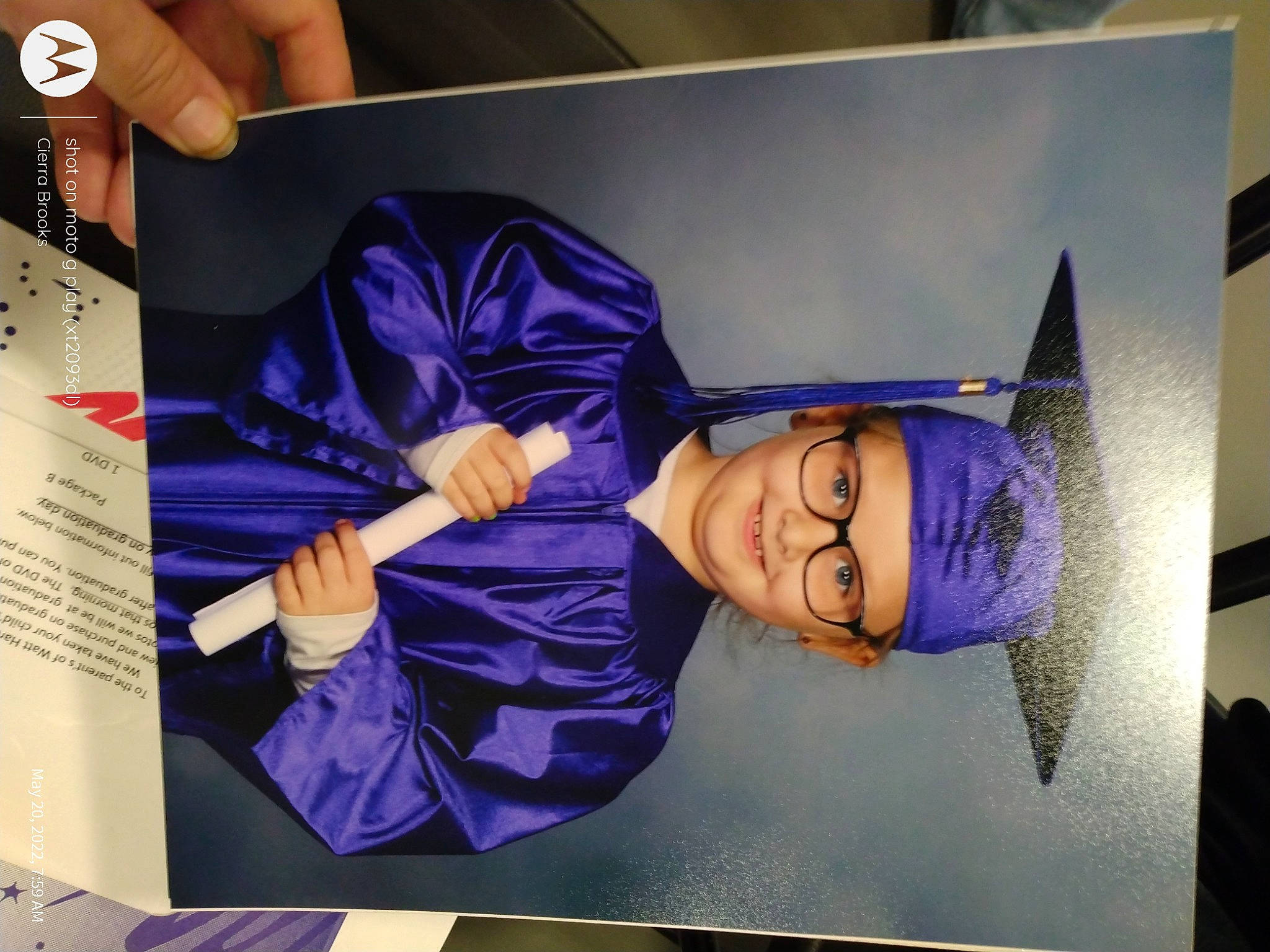 Baylee is registered to the contest to win money with this photo: advertising, art, artist, display_device, electric_blue, finger, font, gesture, graphics, headwear, illustration, joy, magenta, paint, painting, person, purple, room, smile, space