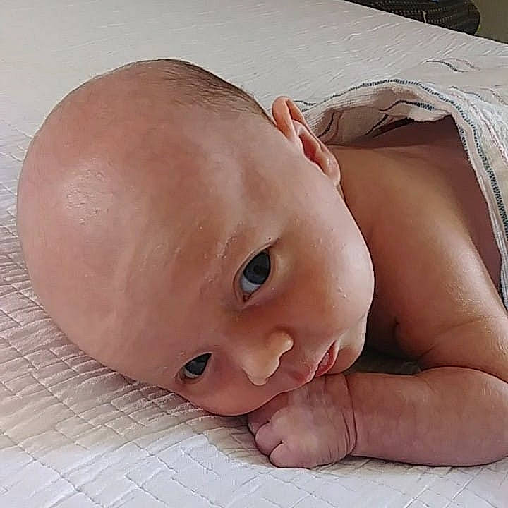 Travis is registered to the contest to win money with this photo: baby, cheek, child, face, head, lip, mouth, muscle, nose, person, skin, stomach, toddler