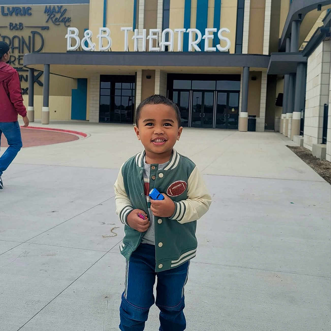 Mackswell joined the competition — help win amazing prizes! architecture, building, city, clothing, coat, cream, dessert, face, food, head, jacket, outdoors, pants, person, photography, portrait, road, shelter, street, urban