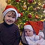 Azelya participe au concours pour gagner de l'argent avec cette photo : child, baby, christmas_tree, santa_hat, holiday, ornaments, lights, festive, smile, cute, celebration, indoors, seasonal, happy, family, toddler, infant, decoration, christmas, warm