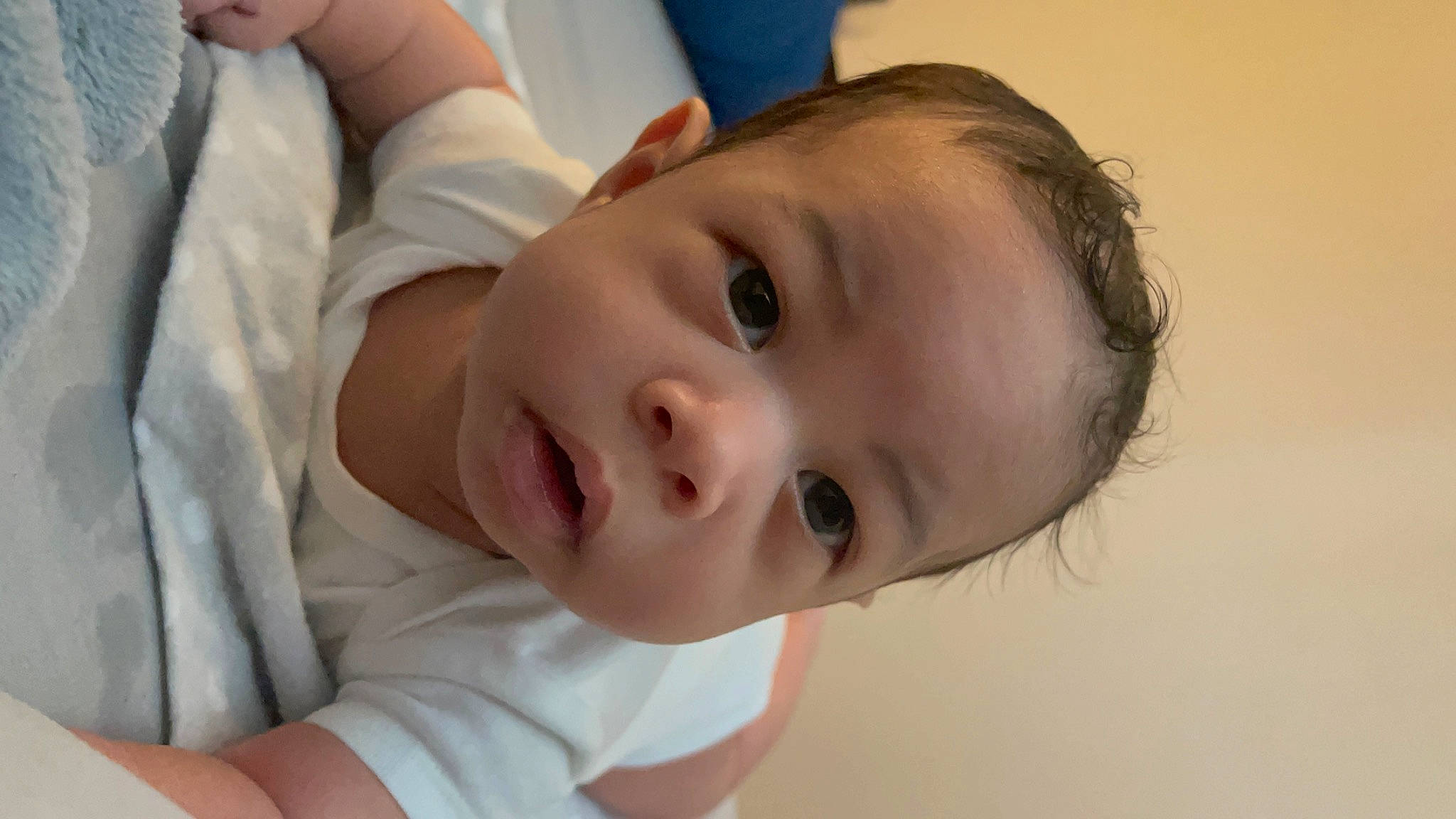 Naim is registered to the contest to win money with this photo: baby, baby_toddler_clothing, cheek, child, comfort, dress, eye, eyebrow, eyelash, fun, hair, happy, iris, lip, mouth, neck, nose, person, skin, sleeve