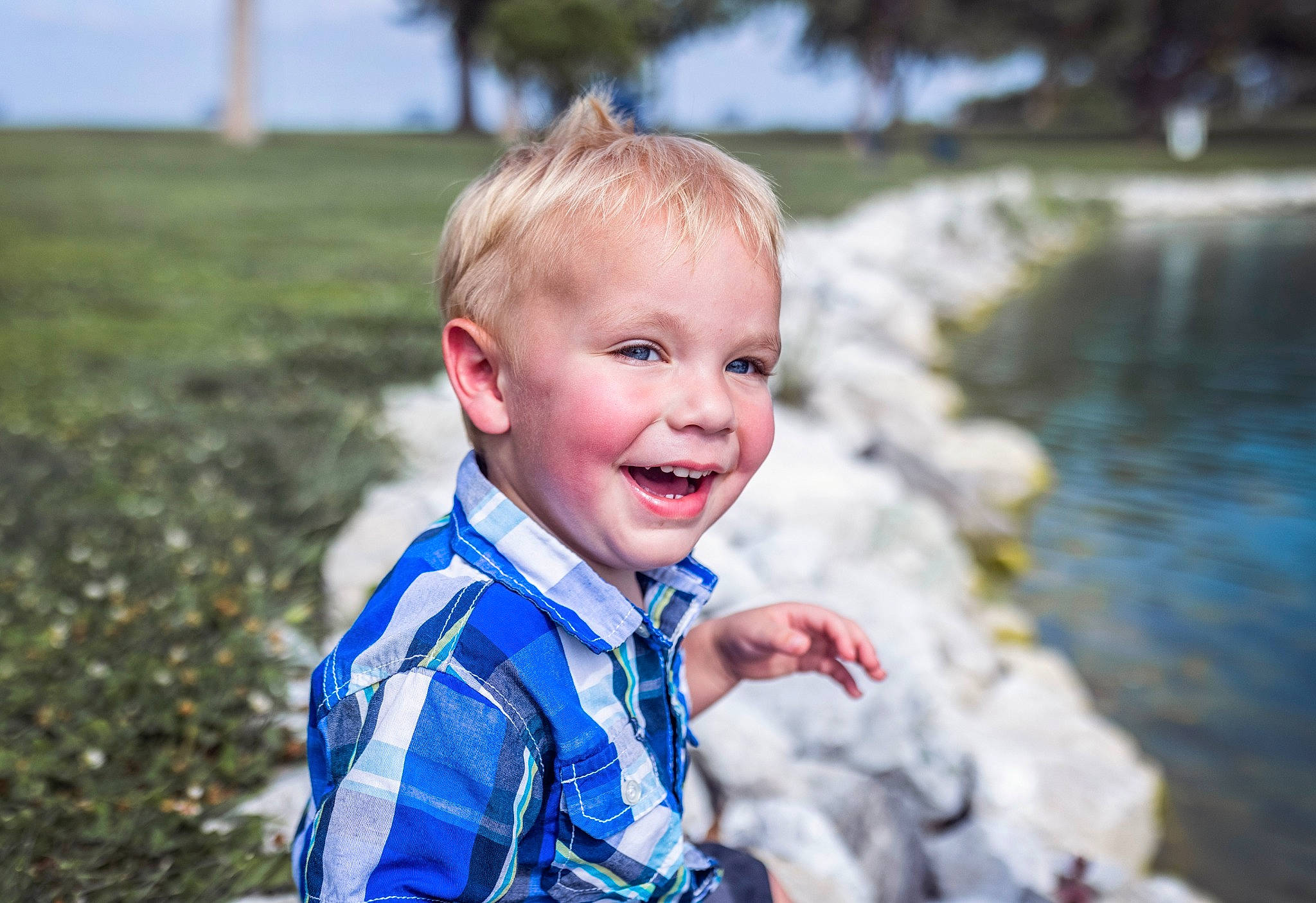 Orion is registered to the contest to win money with this photo: baby, baby_toddler_clothing, blond, child, electric_blue, flash_photography, fun, grass, happy, lake, laugh, leisure, people_in_nature, person, recreation, sitting, smile, summer, toddler, vacation
