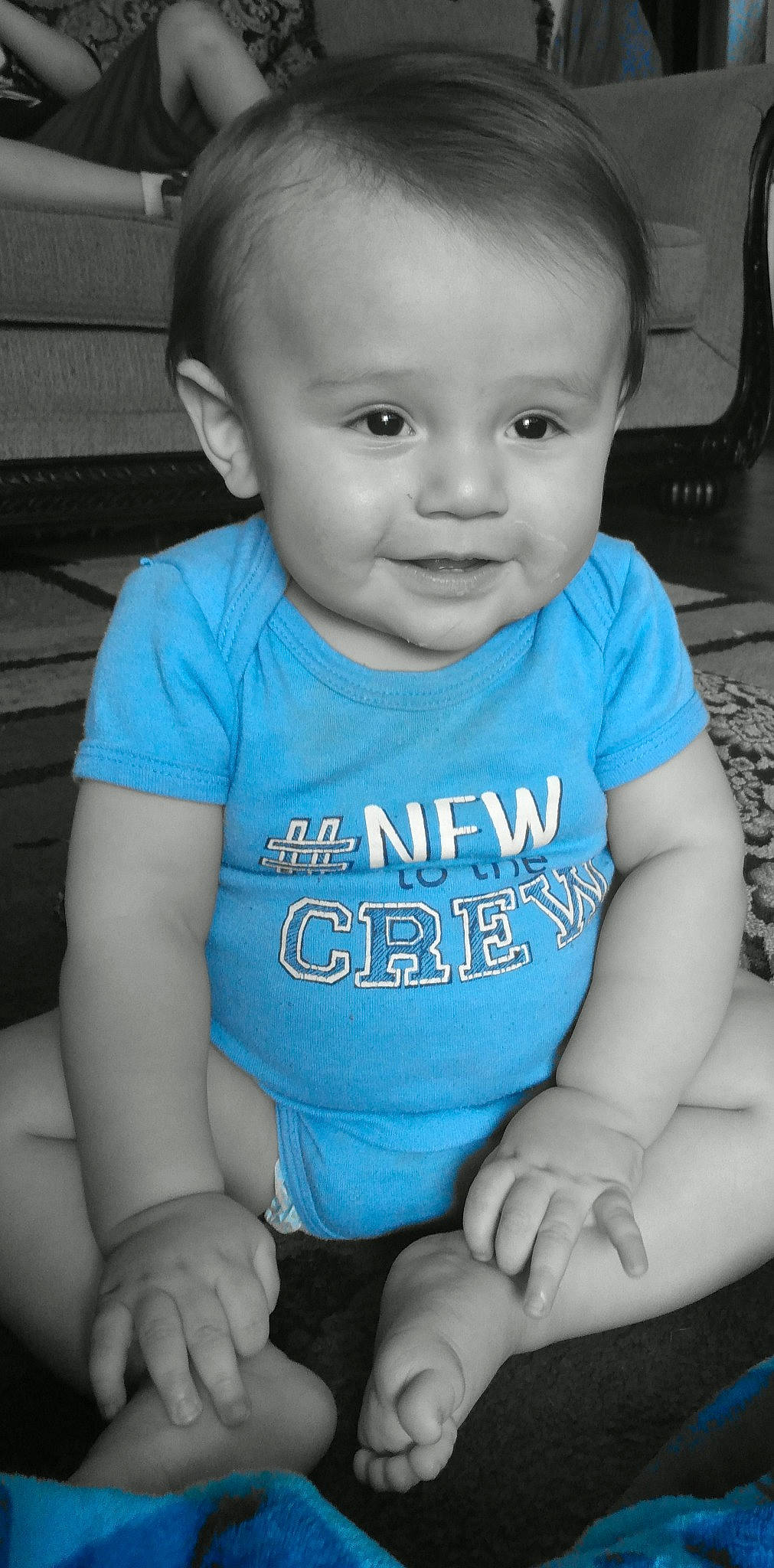 Manuel is registered to the contest to win money with this photo: baby, baby_products, baby_toddler_clothing, blue, cheek, child, face, person, product, sitting, skin, smile, t_shirt, toddler