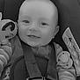 baby, car_seat, smile, plush_toy, straps, pacifier, infant, child, black_and_white, cute, happy, face, hand, clothing, safety, seatbelt, indoor, closeup, portrait, heart
