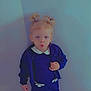 toddler, child, blonde_hair, pigtails, navy_blue, dress, cardigan, boots, standing, indoor, floor, wall, expression, funny_face, cute, small_person, clothing, portrait, person, young_child