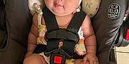 Omi joined the competition — help win amazing prizes! baby, child, car_seat, headband, yellow_bow, straps, blue_eyes, cute, infant, sitting, clothing, hands, legs, feet, face, skin, indoor, floor_tiles, fabric, safety