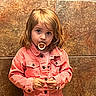 Annalea is registered to the contest to win money with this photo: child, toddler, girl, portrait, standing, pacifier, pink_jacket, jacket, blonde_hair, blue_eyes, serious_expression, buttoned_clothing, hands, indoor, tiled_wall, fashion, closeup, full_body, colorful, photography