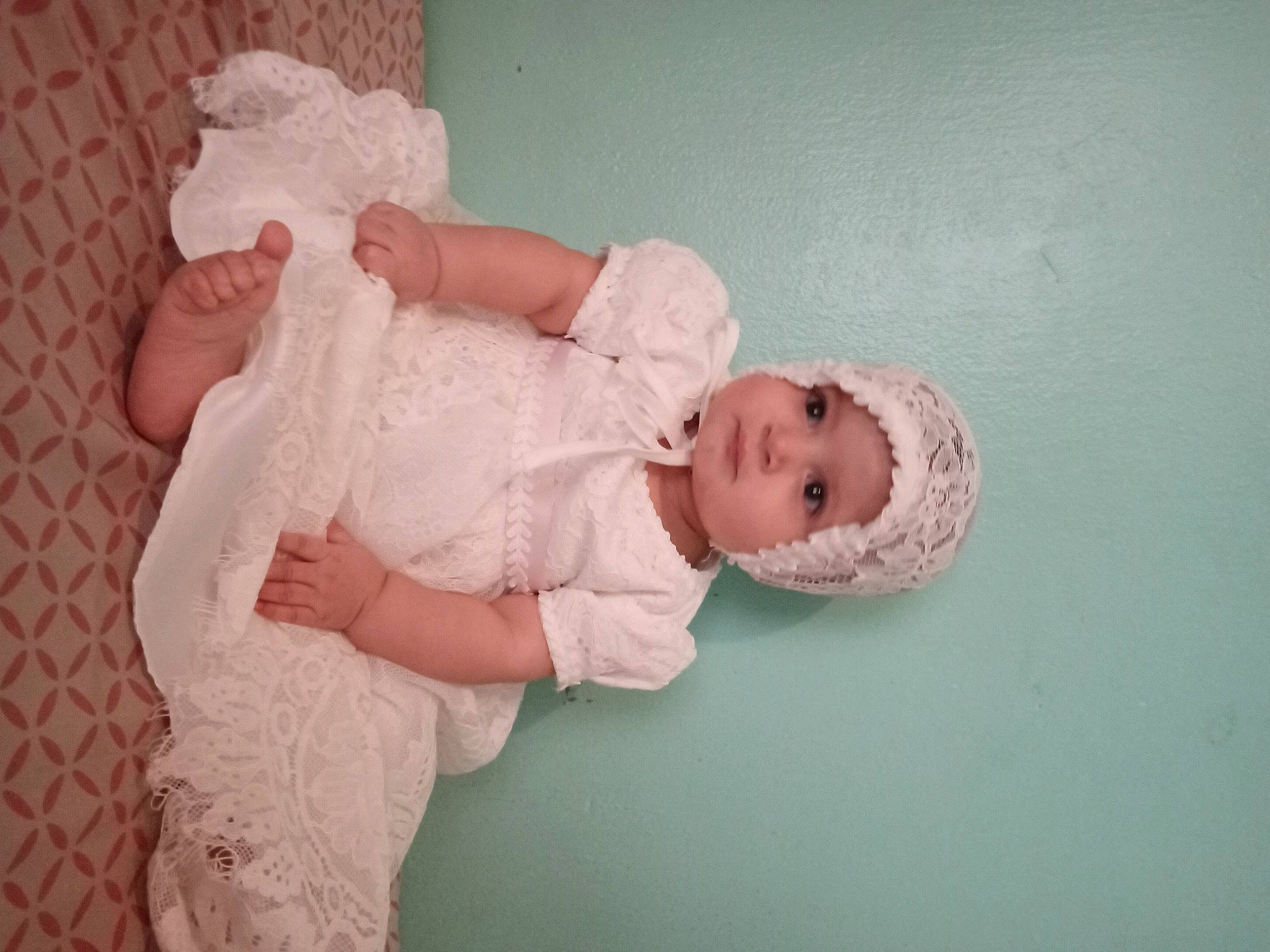 Arianelys is registered to the contest to win money with this photo: arm, baby, baby_toddler_clothing, cheek, comfort, dress, embellishment, eye, fashion_accessory, finger, hand, happy, headwear, human_body, iris, leg, pattern, person, pink, skin