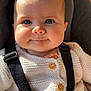 baby, infant, face, eyes, knitted_sweater, blanket, seat, straps, cushion, closeup, smile, cheeks, warm_clothing, indoors, child, cute, portrait, baby_boy, baby_girl, human