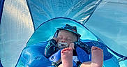 Connor is registered to the contest to win money with this photo: baby, infant, pool, float, blue, water, pacifier, hat, sun_protection, canopy, relaxing, summer, swimming, child, outdoor, feet, floating, sleeps, safety, toy