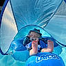 baby, infant, pool, float, blue, water, pacifier, hat, sun_protection, canopy, relaxing, summer, swimming, child, outdoor, feet, floating, sleeps, safety, toy
