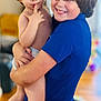 Aiden joined the competition — help win amazing prizes! child, toddler, smiling, holding, indoor, blond_hair, short_hair, blue_shirt, diaper, curious, happy, person, portrait, family, playful, background_blur, flooring, skin, expression, sibling