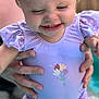 Halle is registered to the contest to win money with this photo: baby, child, toddler, swimsuit, purple, water, pool, smile, happy, face, person, hand, adult, playing, outdoor, summer, fun, splash, clothing, cute